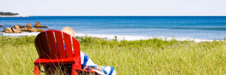 Nova Scotia flag, beach day, Adirondack chair