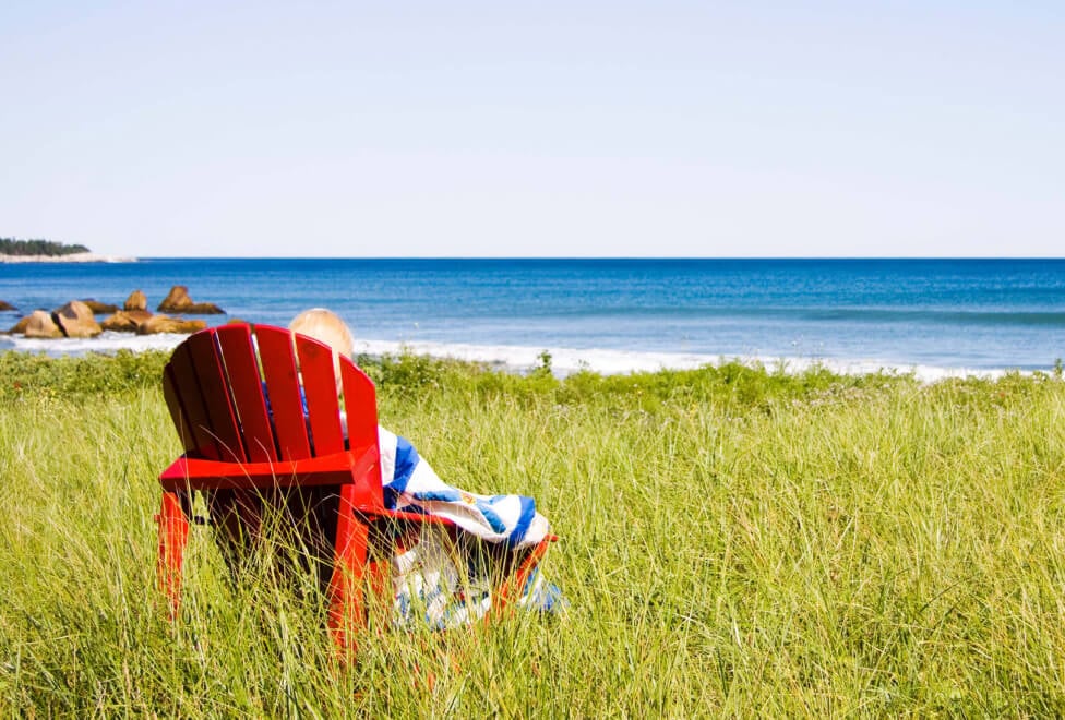 Nova Scotia flag, beach day, Adirondack chair