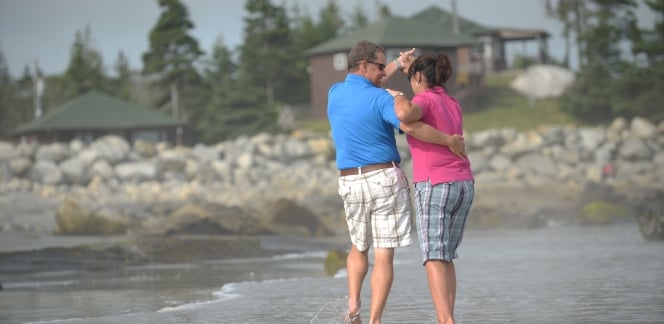 Couple dancing on White Point Beach, romance