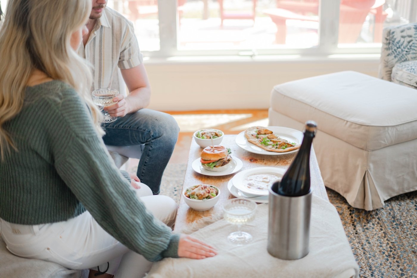 Couple toasts with champagne, wine at White Point in a room