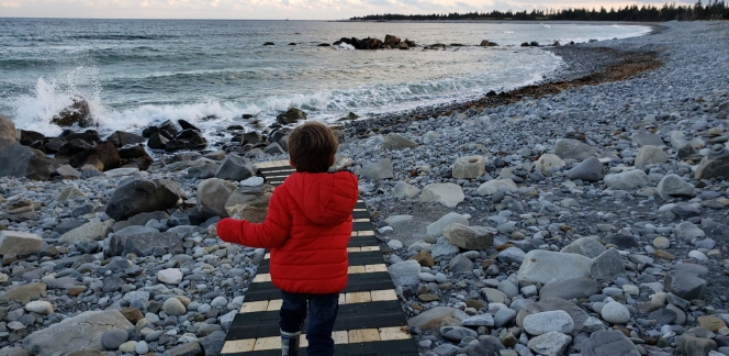 Shoulder Season Winter Child running on stairs