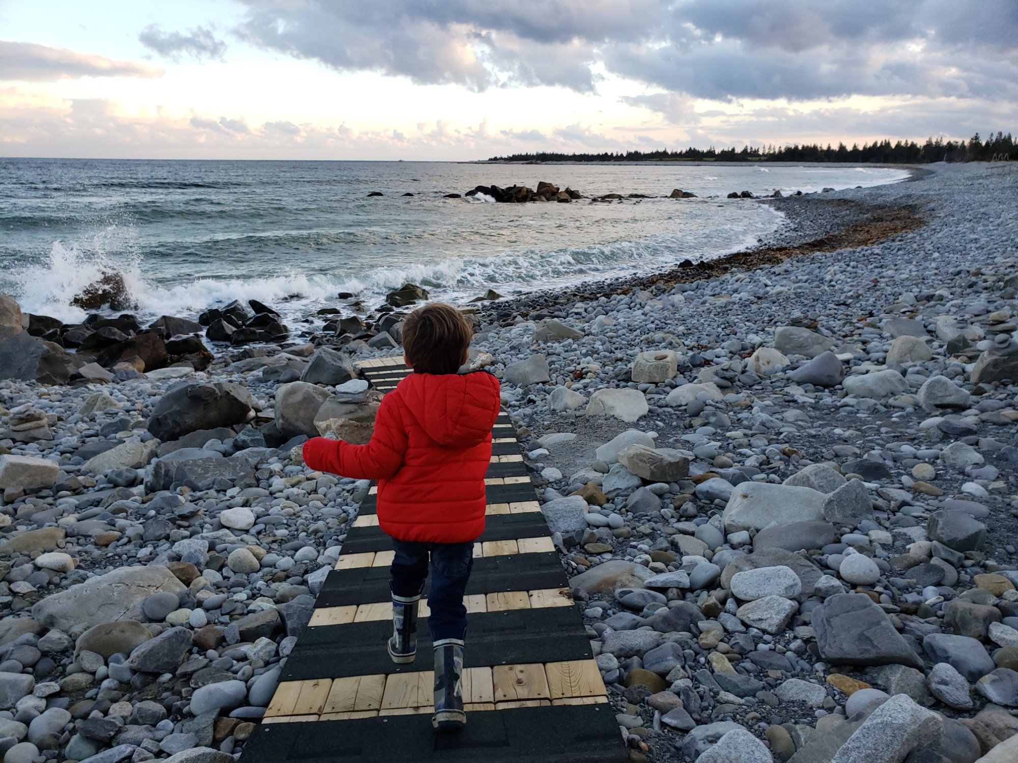Shoulder Season Winter Child running on stairs