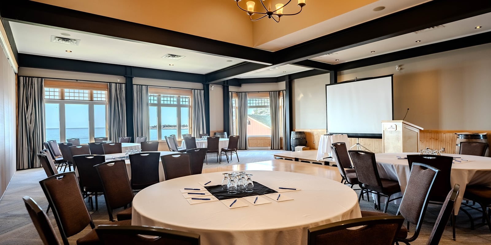 Boardroom with windows and screen