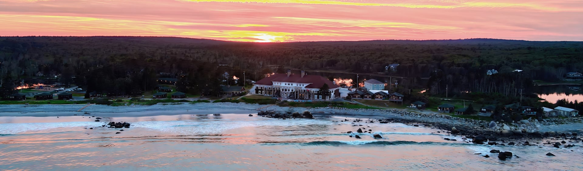 Aerial photo of beach at sunset