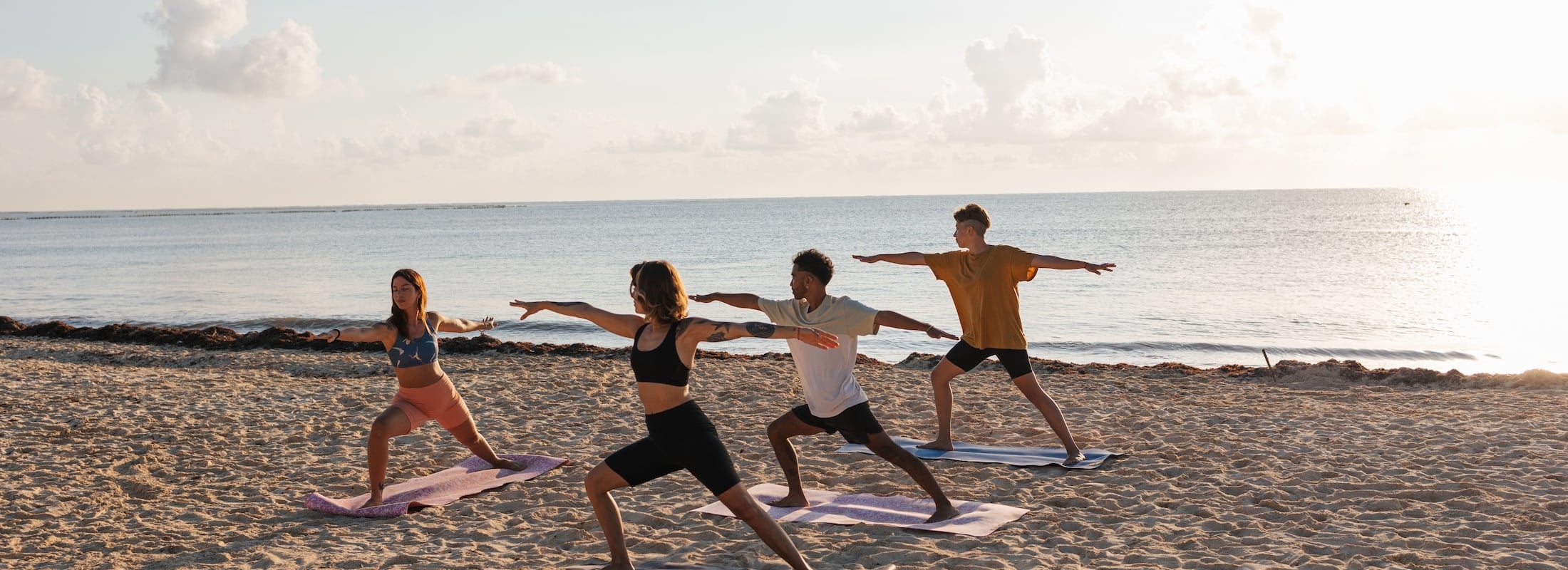 yoga on the beach at White Point Beach Resort