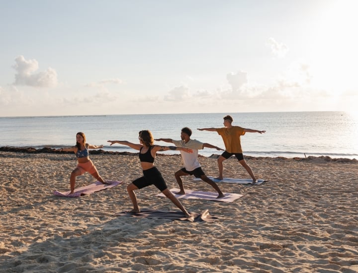yoga on the beach at White Point Beach Resort