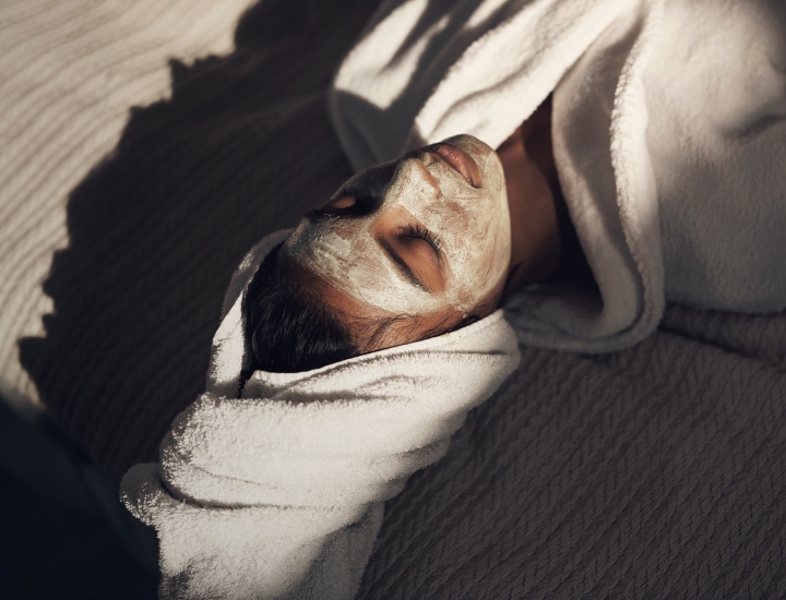 Woman enjoying spa facial treatment