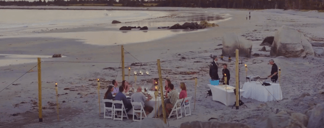 an intimate dining event on the beach at White Point Beach Resort