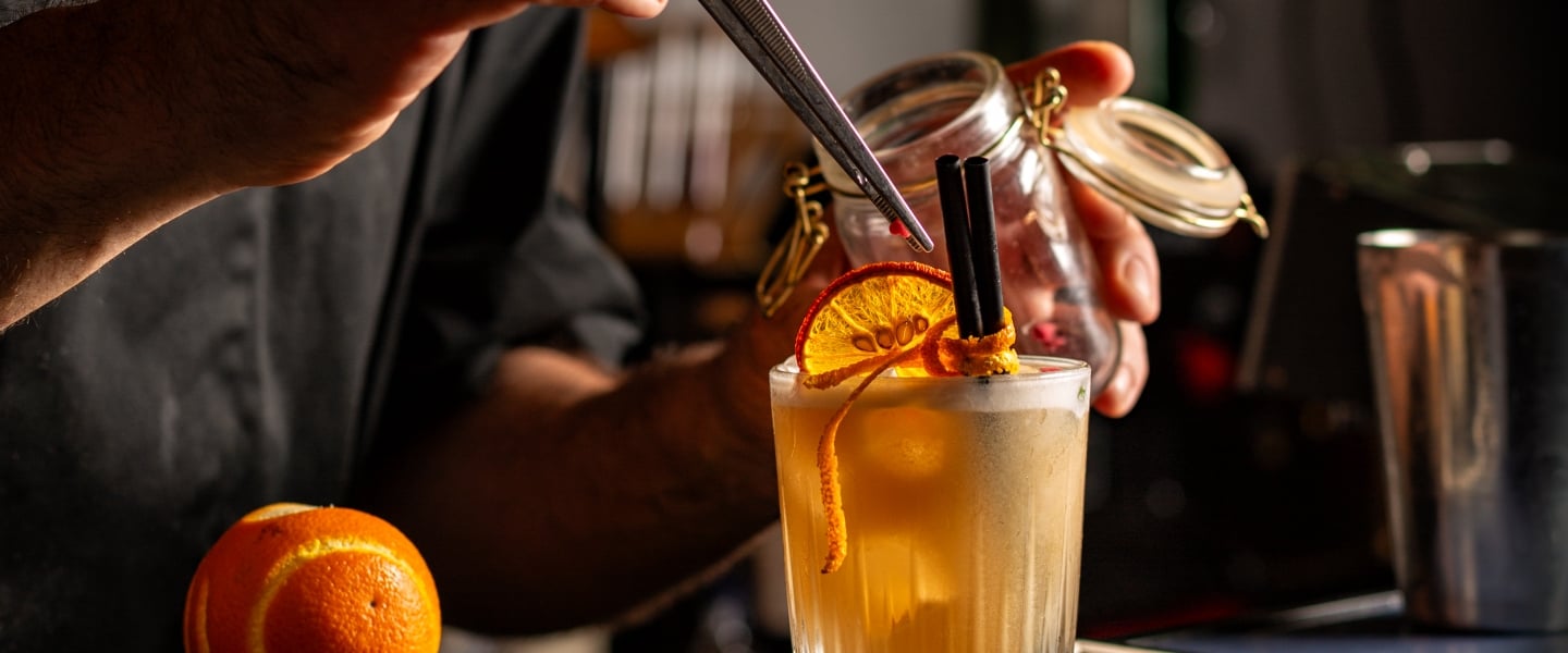 Preparing Smoky Spiced Orange Cocktail