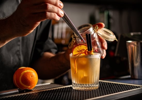Preparing Smoky Spiced Orange Cocktail