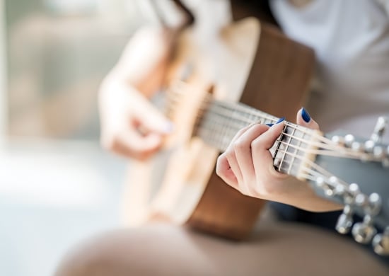 woman playing guitar