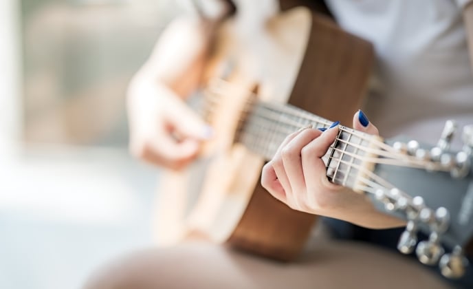 woman playing guitar