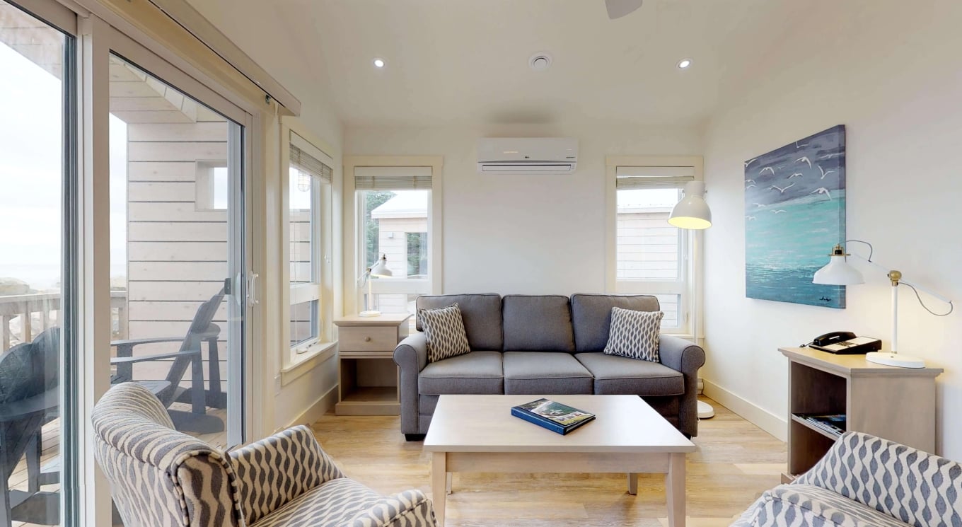 the living area and deck in a White Point Beach Resort cottage