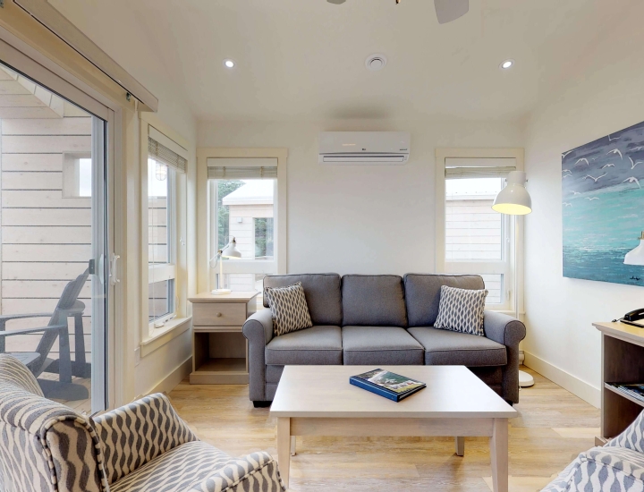 the living area and deck in a White Point Beach Resort cottage