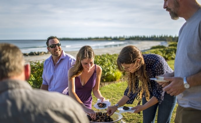 Group of people enjoying mussels