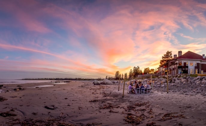 sunset dining on the beach at White Point Beach Resort