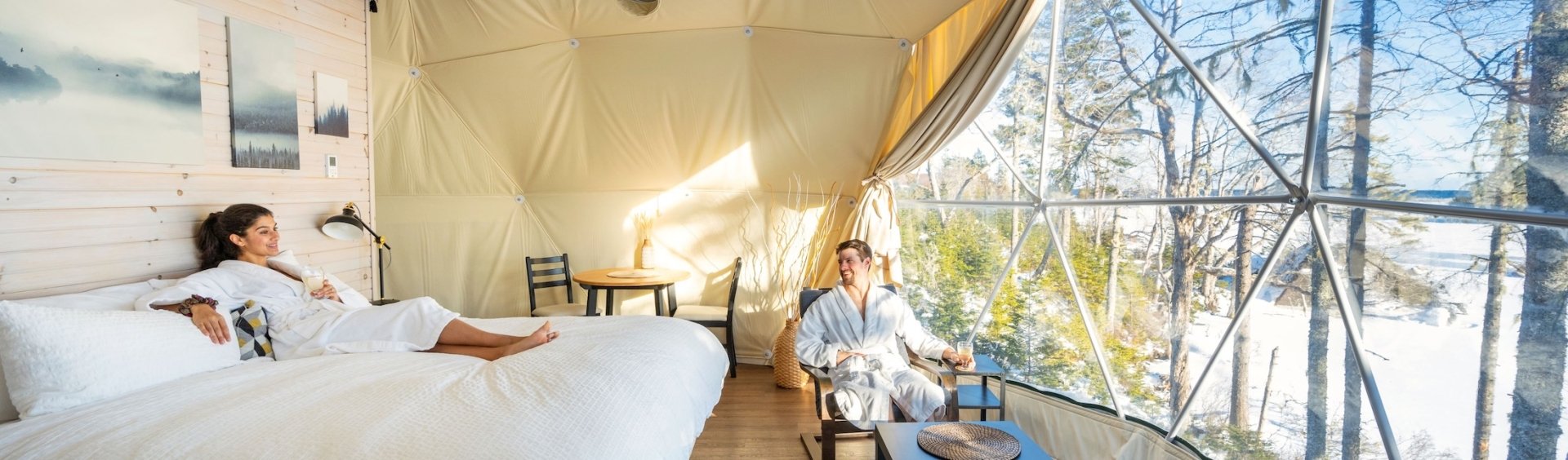 a couple in robes lounging in a glome at White Point Beach Resort