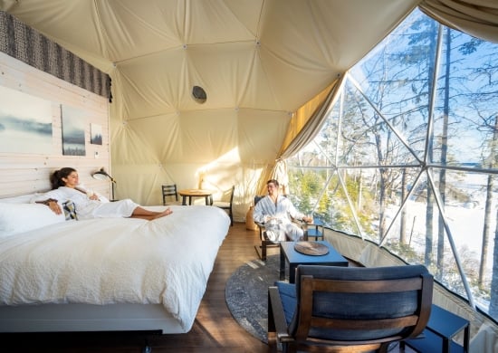 a couple in robes lounging in a glome at White Point Beach Resort