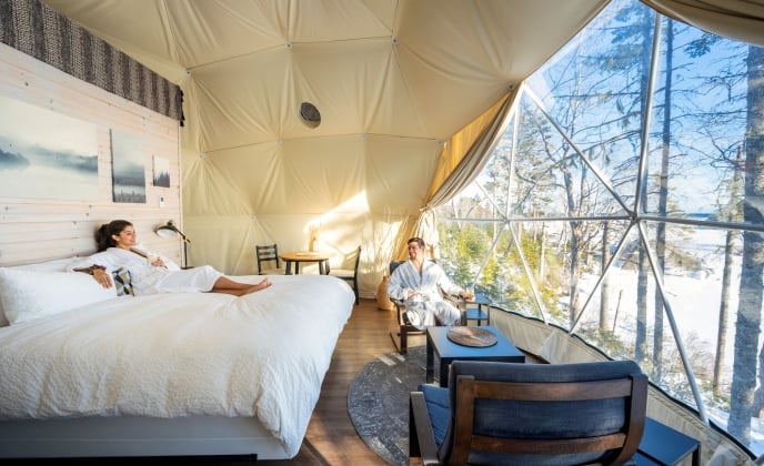a couple in robes lounging in a glome at White Point Beach Resort